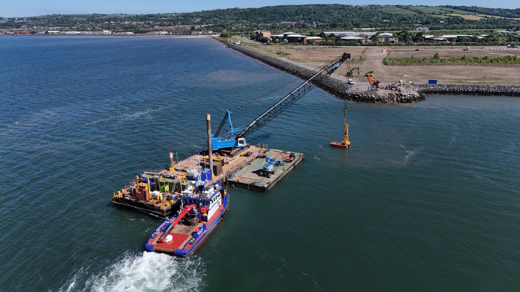 Aerial photograph of marine crane operations from a barge