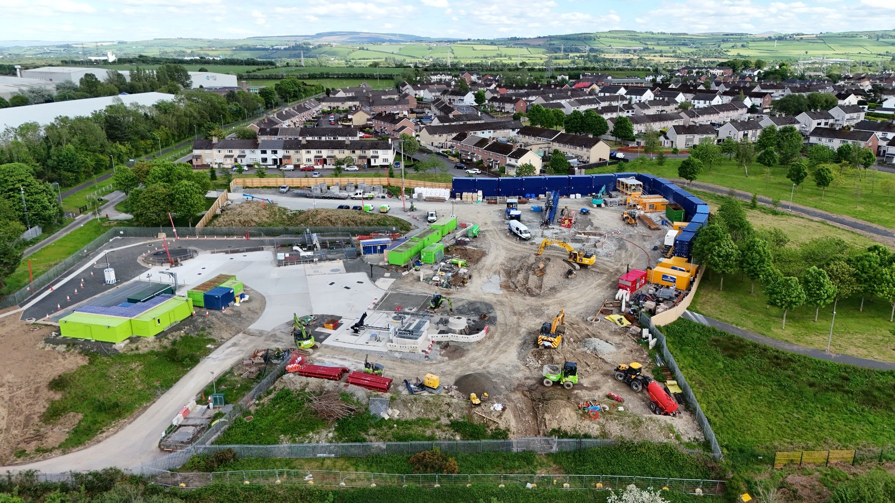 Aerial photograph showing a busy construction site and surrounding neighbourhood