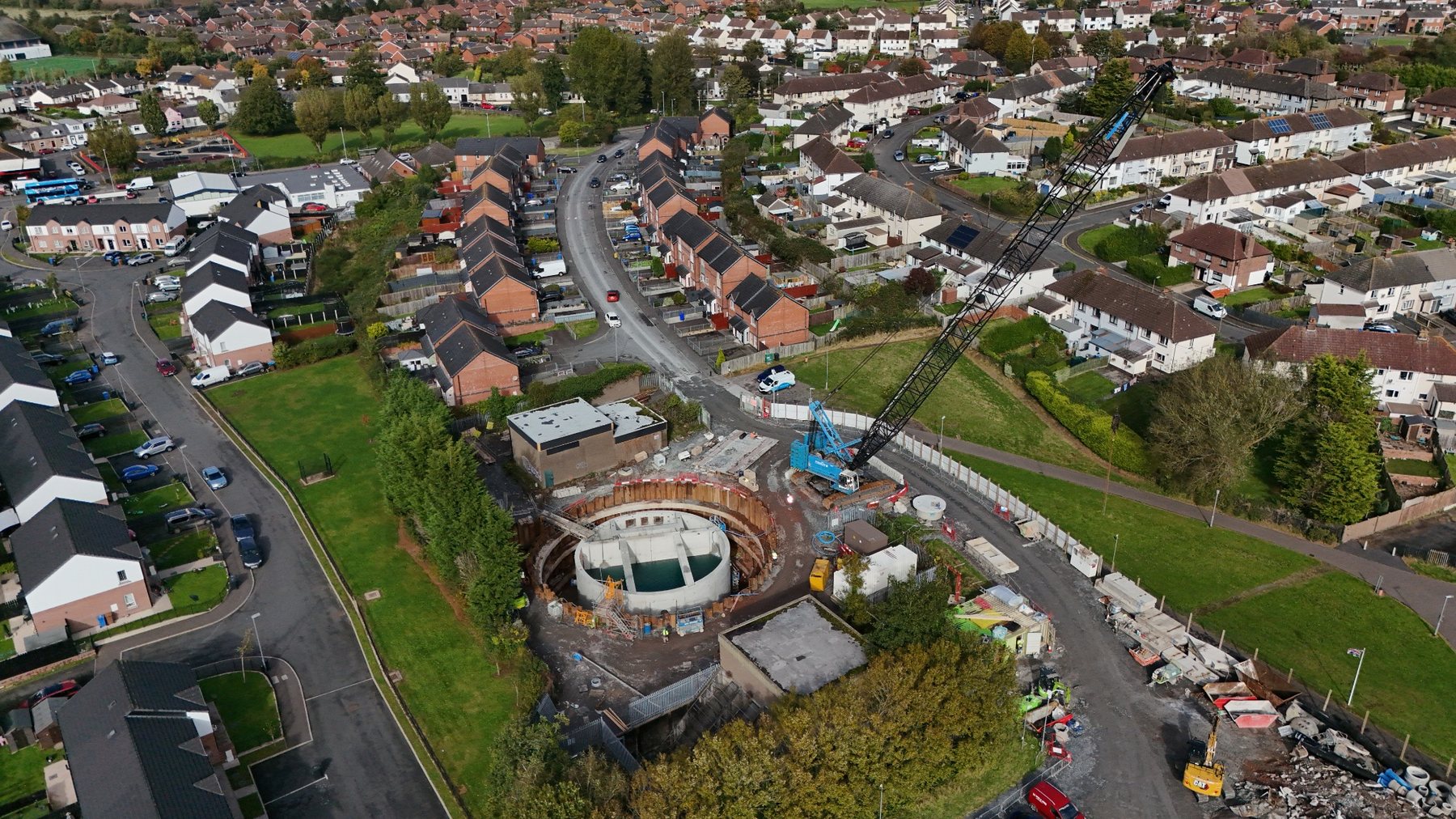 Aerial photograph of construction progress on a circular infrastructure structure